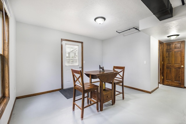 1863 Sunvale Dr SW, Wyoming, MI 49519 - dining area with baseboards and a textured ceiling