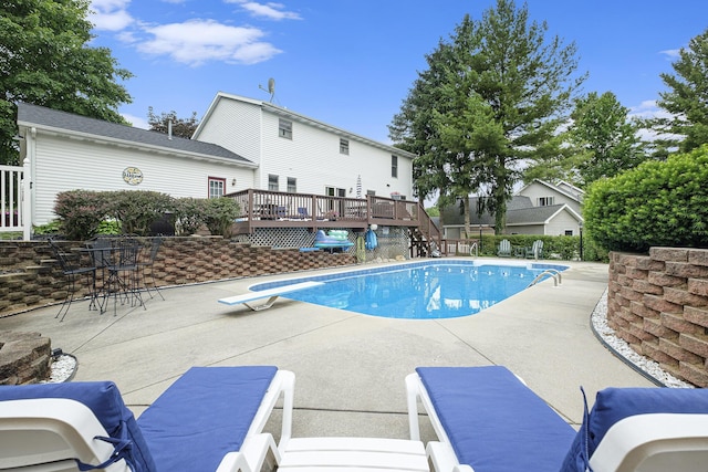 1863 Sunvale Dr SW, Wyoming, MI 49519 - outdoor pool featuring a deck, a patio area, a diving board, and stairs