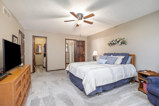 1863 Sunvale Dr SW, Wyoming, MI 49519 - bedroom featuring light carpet, a ceiling fan, and ensuite bathroom