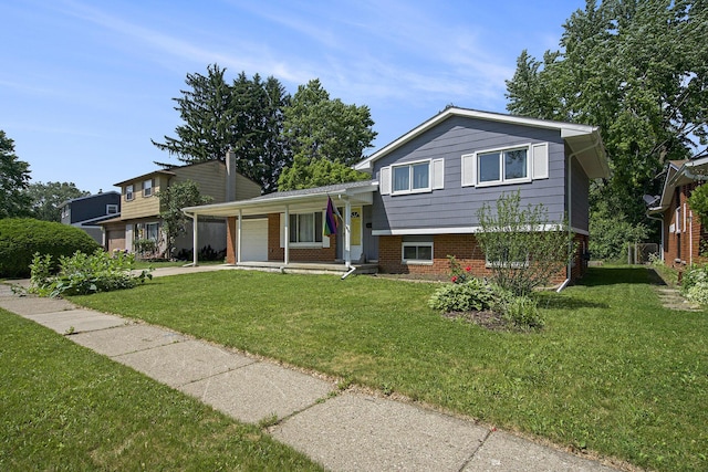 8683 Hemlock Ct, Ypsilanti, MI 48198 - tri-level home with a garage, brick siding, and a front yard