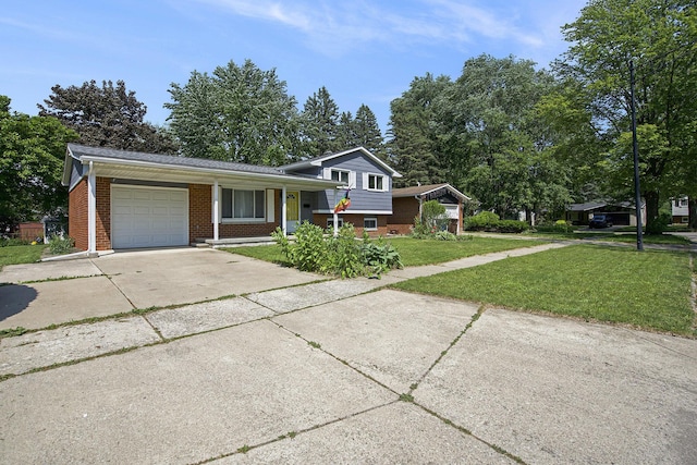 8683 Hemlock Ct, Ypsilanti, MI 48198 - split level home with a garage, concrete driveway, brick siding, and a front yard