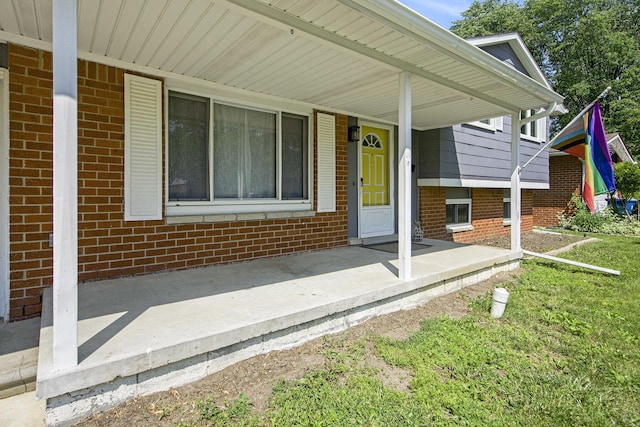 8683 Hemlock Ct, Ypsilanti, MI 48198 - view of exterior entry with brick siding and covered porch