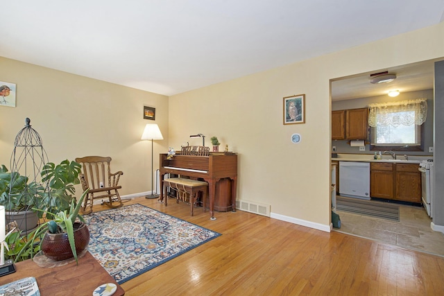 8683 Hemlock Ct, Ypsilanti, MI 48198 - sitting room with light wood-style floors
