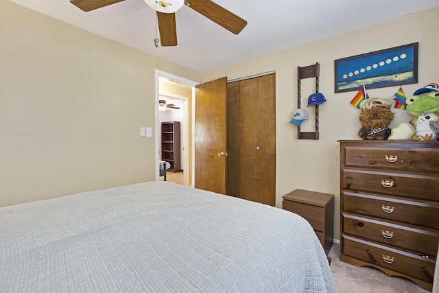 8683 Hemlock Ct, Ypsilanti, MI 48198 - bedroom with light carpet, a closet, and ceiling fan