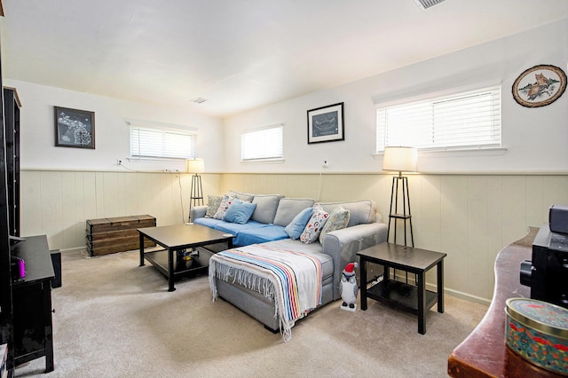 8683 Hemlock Ct, Ypsilanti, MI 48198 - living area featuring wainscoting, carpet floors, and wooden walls