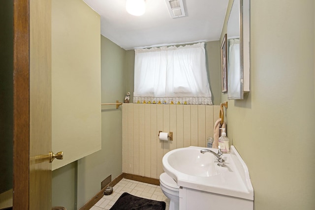 8683 Hemlock Ct, Ypsilanti, MI 48198 - half bathroom featuring toilet and vanity
