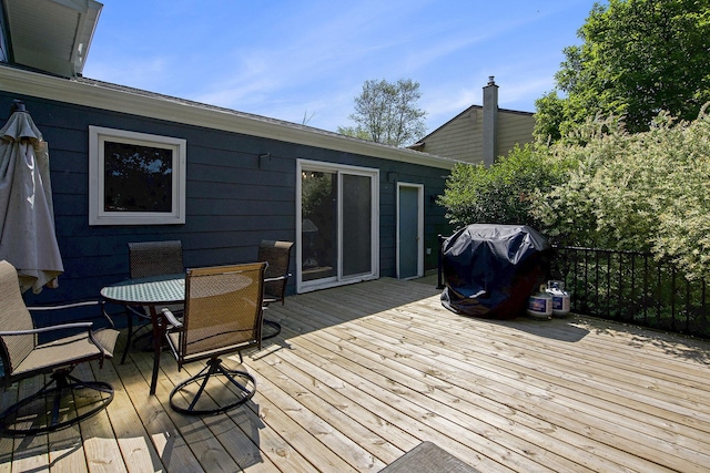 8683 Hemlock Ct, Ypsilanti, MI 48198 - wooden deck featuring area for grilling and outdoor dining area