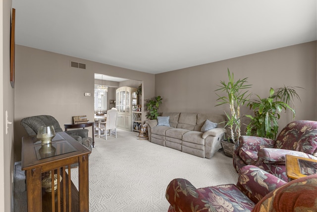 24663 Balsam Ct, Flat Rock, MI 48134 - living area featuring carpet floors and a chandelier