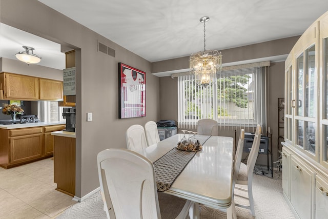 24663 Balsam Ct, Flat Rock, MI 48134 - dining area featuring a chandelier and light tile patterned floors