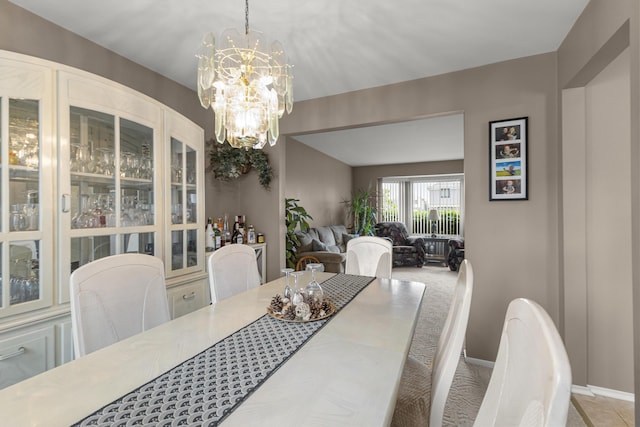 24663 Balsam Ct, Flat Rock, MI 48134 - dining area featuring a chandelier and baseboards