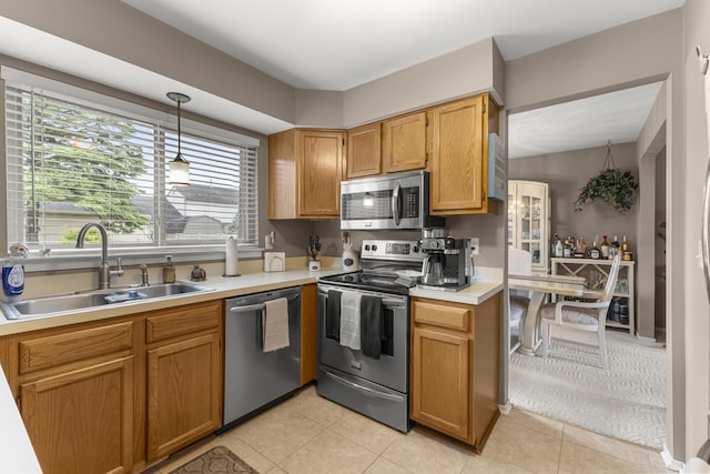 24663 Balsam Ct, Flat Rock, MI 48134 - kitchen featuring stainless steel appliances, light countertops, decorative light fixtures, and light tile patterned flooring
