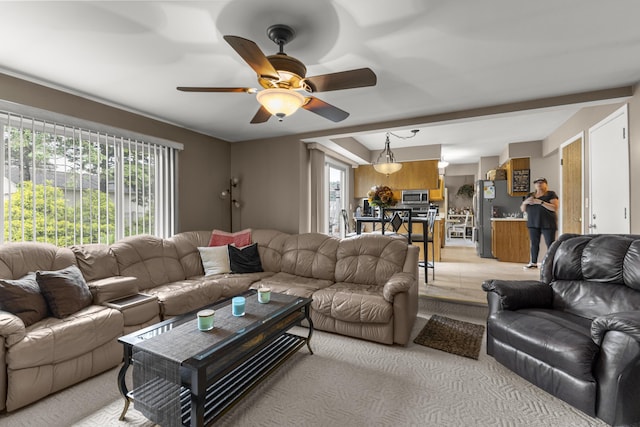 24663 Balsam Ct, Flat Rock, MI 48134 - living area with a ceiling fan and light carpet