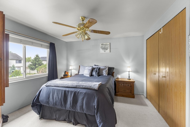 24663 Balsam Ct, Flat Rock, MI 48134 - bedroom featuring light carpet, a ceiling fan, and a closet