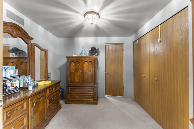 24663 Balsam Ct, Flat Rock, MI 48134 - bedroom featuring light colored carpet and two closets