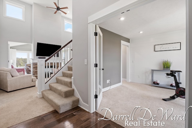 3940 Egypt Valley Ave NE, Ada, MI 49301 - stairs with healthy amount of natural light, wood finished floors, recessed lighting, ceiling fan, and a towering ceiling