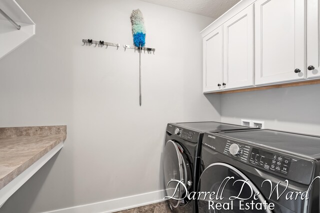 3940 Egypt Valley Ave NE, Ada, MI 49301 - laundry room with cabinet space and washing machine and clothes dryer