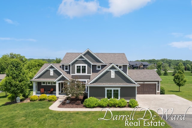 3940 Egypt Valley Ave NE, Ada, MI 49301 - craftsman inspired home with a front yard, concrete driveway, and a garage