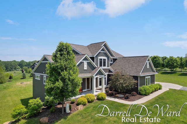 3940 Egypt Valley Ave NE, Ada, MI 49301 - craftsman-style home featuring a front yard and a shingled roof