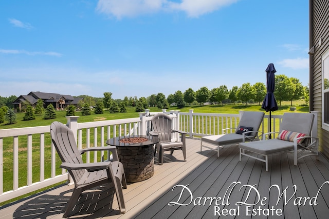3940 Egypt Valley Ave NE, Ada, MI 49301 - deck featuring an outdoor fire pit and a yard
