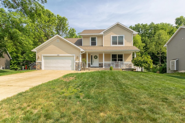 1481 Kristen Path, Saint Joseph, MI 49085 - traditional-style home with covered porch, an attached garage, concrete driveway, stone siding, and a front yard