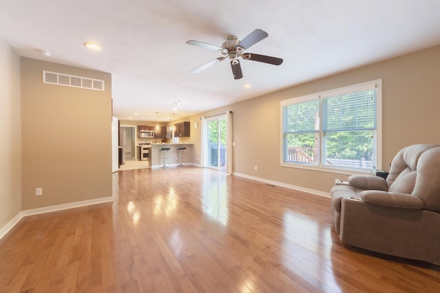 1481 Kristen Path, Saint Joseph, MI 49085 - living room featuring ceiling fan, light wood finished floors, and recessed lighting