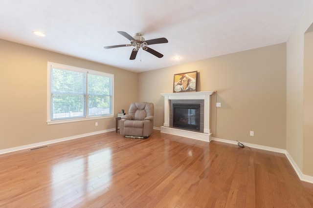 1481 Kristen Path, Saint Joseph, MI 49085 - sitting room with a ceiling fan, light wood-style flooring, a glass covered fireplace, and recessed lighting