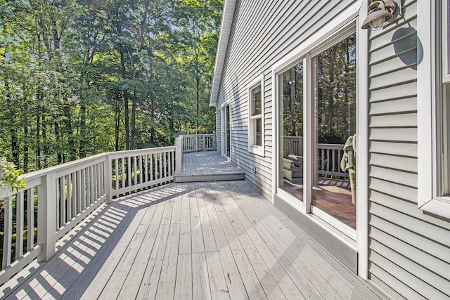 9510 Pere Marquette Dr, Canadian Lakes, MI 49346 - wooden terrace featuring view of scattered trees