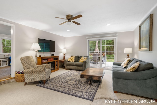 15405 Barry St, West Olive, MI 49460 - carpeted living room with a ceiling fan, ornamental molding, and recessed lighting
