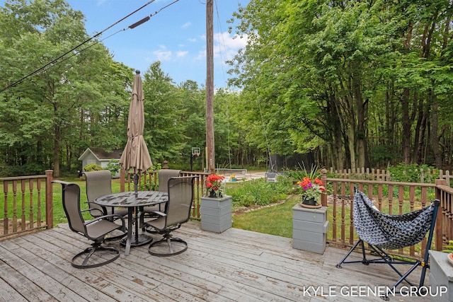15405 Barry St, West Olive, MI 49460 - wooden deck with outdoor dining area