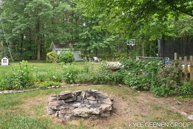 15405 Barry St, West Olive, MI 49460 - view of yard with a fire pit and a storage shed