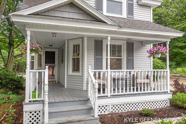 15405 Barry St, West Olive, MI 49460 - entrance to property with a porch and a shingled roof