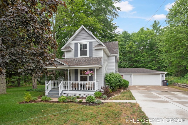 15405 Barry St, West Olive, MI 49460 - view of front of house featuring a porch, roof with shingles, a front yard, a detached garage, and an outbuilding