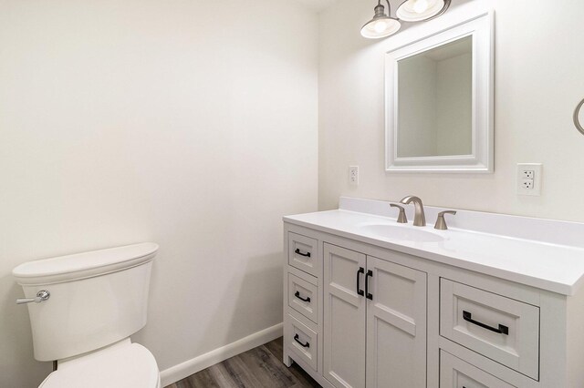 922 Marion Ave, Big Rapids, MI 49307 - half bathroom with vanity and wood finished floors