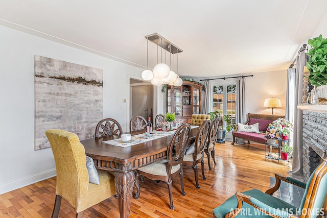 740 Van Raalte Ave, Holland, MI 49423 - dining area featuring light wood-type flooring and baseboards
