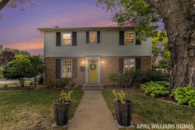 740 Van Raalte Ave, Holland, MI 49423 - colonial inspired home with a yard and brick siding