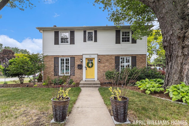 740 Van Raalte Ave, Holland, MI 49423 - view of front facade featuring a front lawn and brick siding