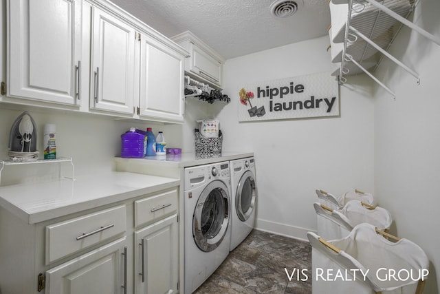 1632 Red Stem Dr, Holland, MI 49424 - washroom featuring cabinet space, washer and dryer, stone finish flooring, and a textured ceiling