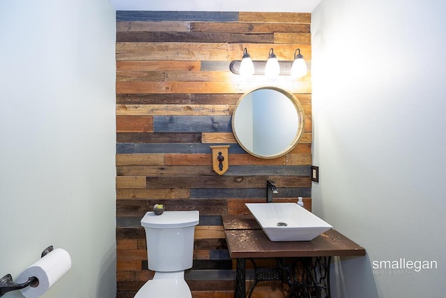 3192 W Sisson Rd, Freeport, MI 49325 - half bath featuring a sink and wooden walls
