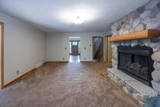 3192 W Sisson Rd, Freeport, MI 49325 - unfurnished living room with carpet and a fireplace