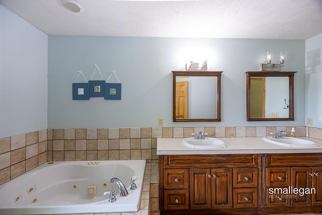3192 W Sisson Rd, Freeport, MI 49325 - bathroom featuring double vanity, a whirlpool tub, and a textured ceiling