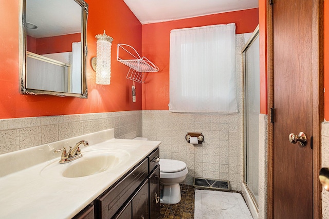 29 Douglas Ave, Coldwater, MI 49036 - full bath featuring vanity, a shower stall, tile walls, and wainscoting