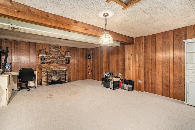 29 Douglas Ave, Coldwater, MI 49036 - living room featuring wooden walls, a desk, a brick fireplace, and beam ceiling