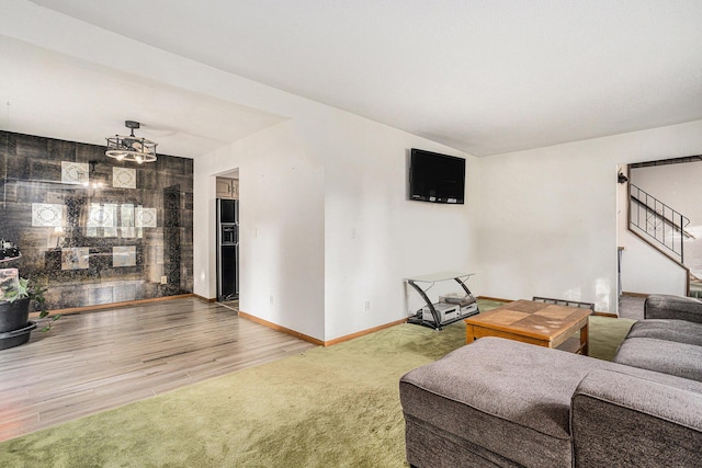 29 Douglas Ave, Coldwater, MI 49036 - carpeted living room featuring stairway and wood finished floors
