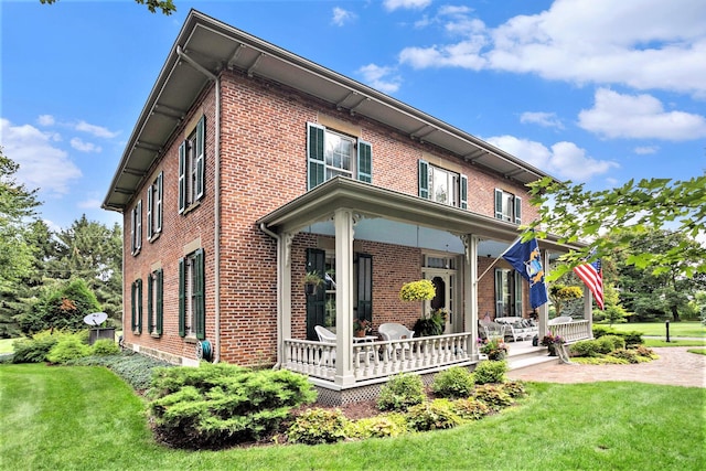 14011 Verona Rd, Marshall, MI 49068 - view of front of property featuring brick siding, a front lawn, and covered porch