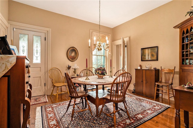 14011 Verona Rd, Marshall, MI 49068 - dining area with wood finished floors and a chandelier