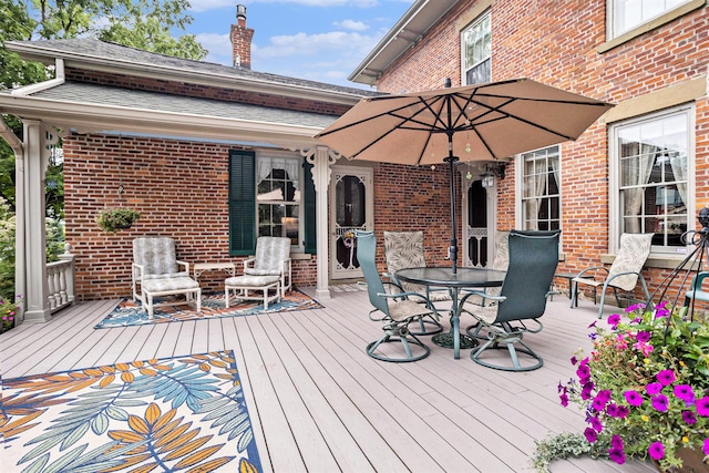 14011 Verona Rd, Marshall, MI 49068 - wooden terrace with outdoor dining area