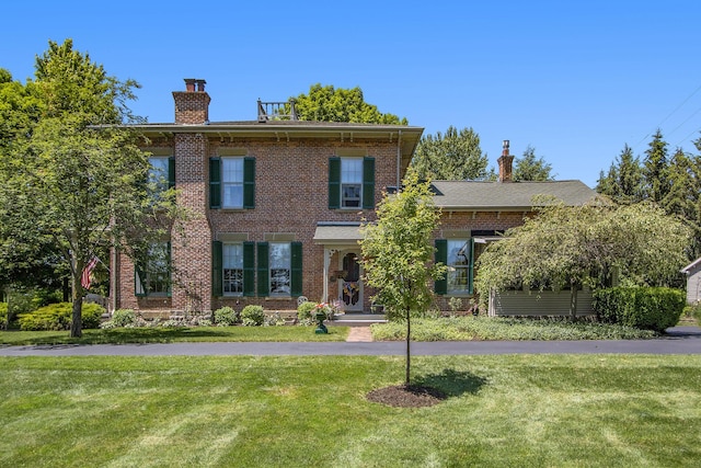 14011 Verona Rd, Marshall, MI 49068 - italianate house featuring a chimney, a front lawn, and brick siding