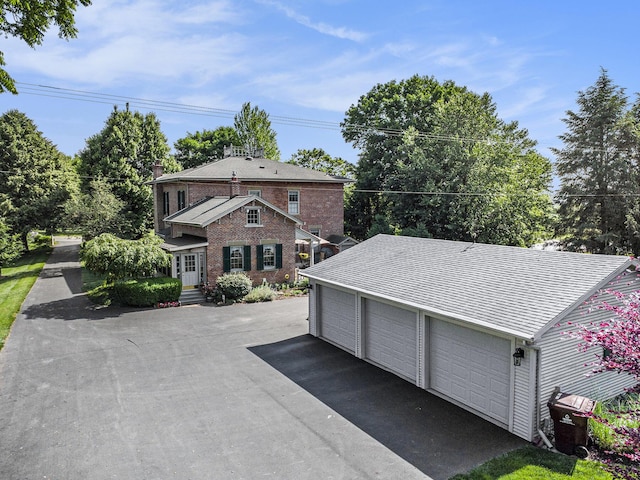 14011 Verona Rd, Marshall, MI 49068 - view of front of house with a garage and brick siding