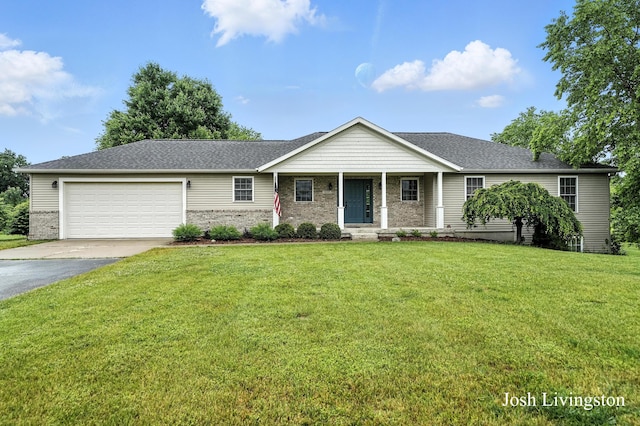 9337 Andrew Farms Dr, Alto, MI 49302 - ranch-style house featuring driveway, an attached garage, a front lawn, covered porch, and roof with shingles