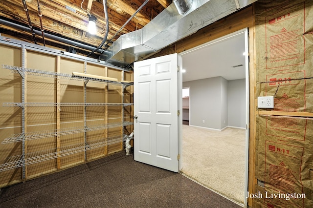 9337 Andrew Farms Dr, Alto, MI 49302 - unfinished basement with dark colored carpet and baseboards